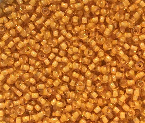 Toho Seed Beads size 11/0 Transparent Gold/White-lined TRD-949