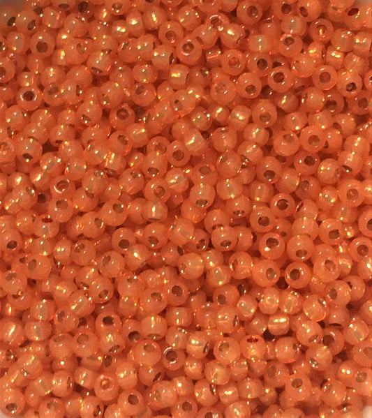 Toho Seed Beads size 11/0 Silver-lined, Milky Grapefruit TRD-PF2112